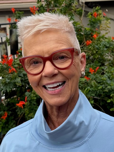 Image of Kim Ball wearing red glasses
